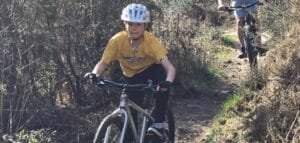 7-year-old boy practicing bike control on a beginner off-road trail in the Surrey Hills