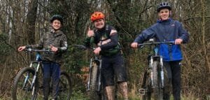 Excited young riders smiling during a Marmalade MTB off-road taster session