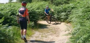 Excited young riders smiling during a Marmalade MTB off-road taster session