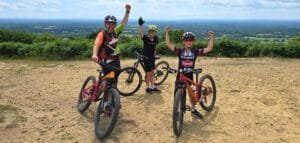 Excited young riders smiling during a Marmalade MTB off-road taster session