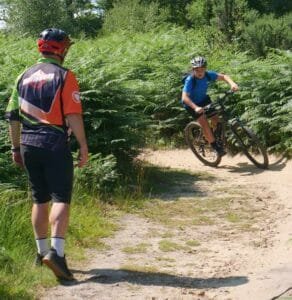 Excited young riders smiling during a Marmalade MTB off-road taster session