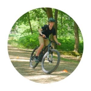 Testimonial slider image of young rider and marmalade mtb instructor